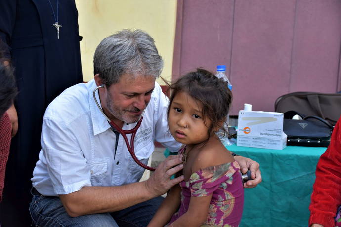 Examining girl at camp