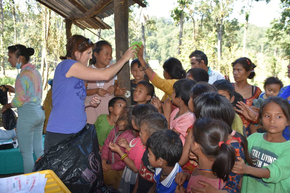 Andrea distributing toys at Cisapani