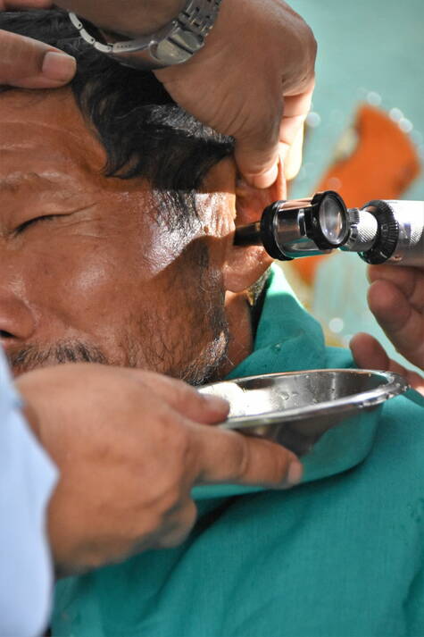 Syringing an Ear in a Health Camp