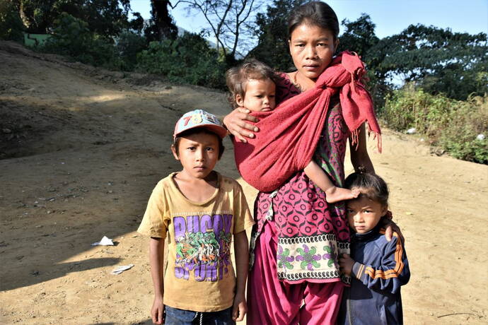 ... and the whole family of normal weight in November 2019, 6 months after monthly rice deliveries (the girl in her mother's sling) 
