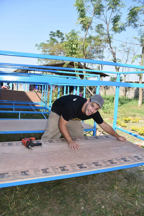 Tobias Bacchetto helping to construct the beds.jpg