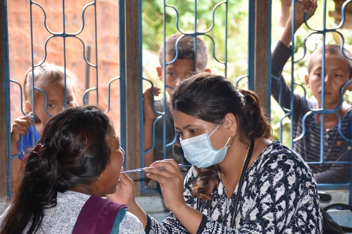 Dentist at work during health camp in Naya Basti